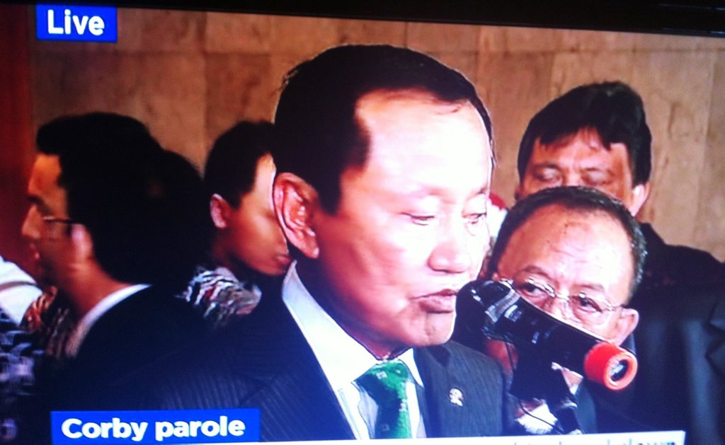 Indonesian Justice Minister Amir Syamsuddin announcing Corby is one of the prisoners who have been granted parole, live on ABC television. Indonesian Justice Minister Amir Syamsuddin announcing Corby is one of the prisoners who have been granted parole, live on ABC television.